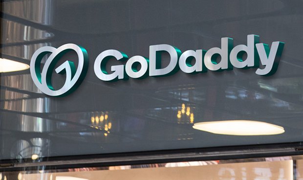 GoDaddy long term, advanced services could solve slow growth 11 godaddy wall logo new 2020 buil
