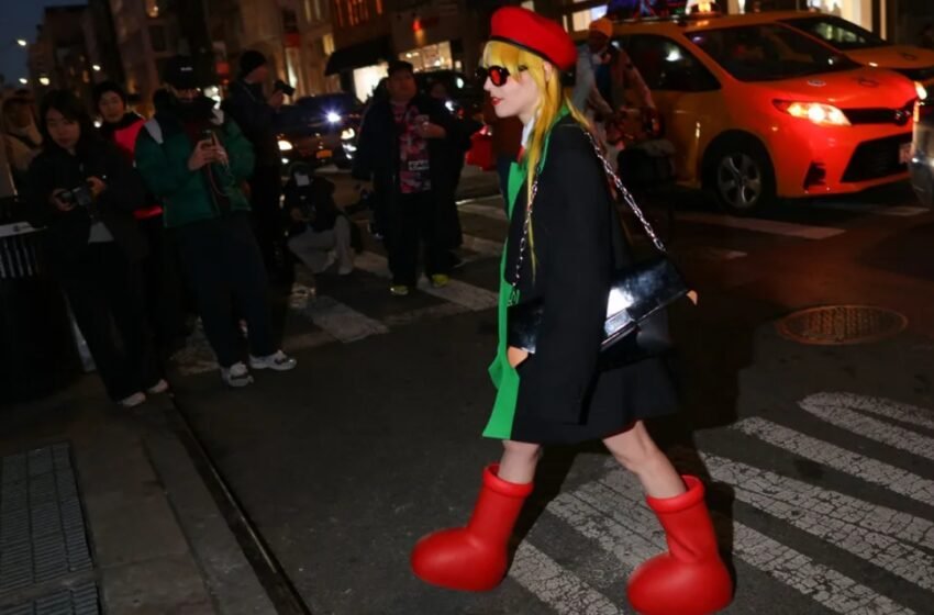 Why Is Everyone Wearing These Cartoonish Red Boots ?